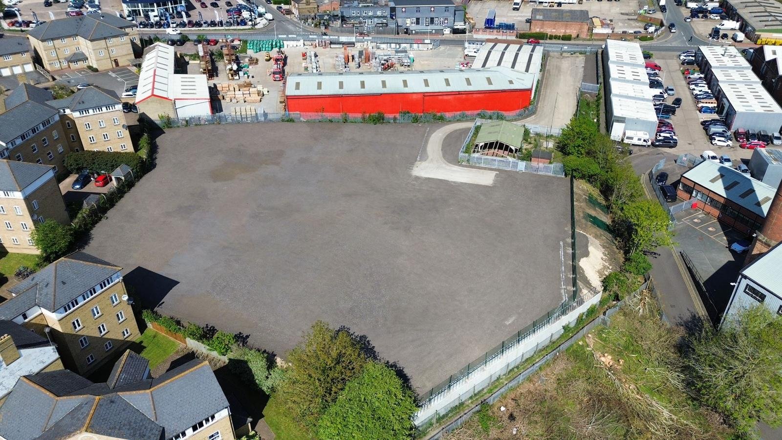 Secure open-storage commercial yard with shipping containers